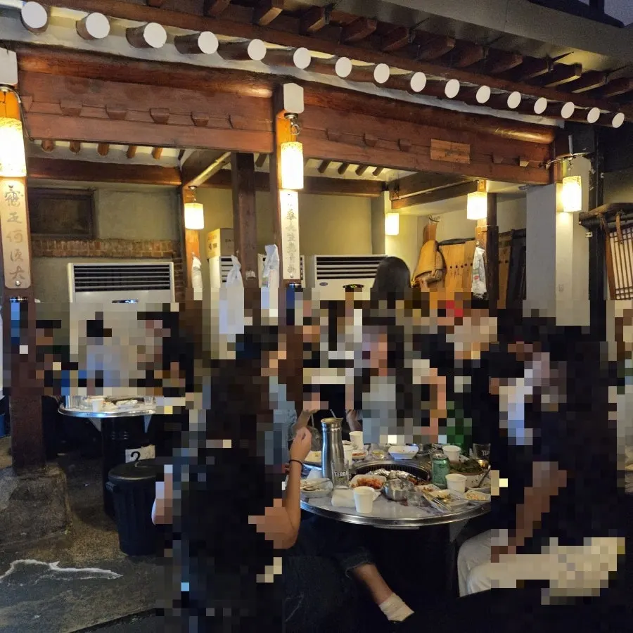 Evening Korean BBQ restaurant scene in Jongno 3-ga