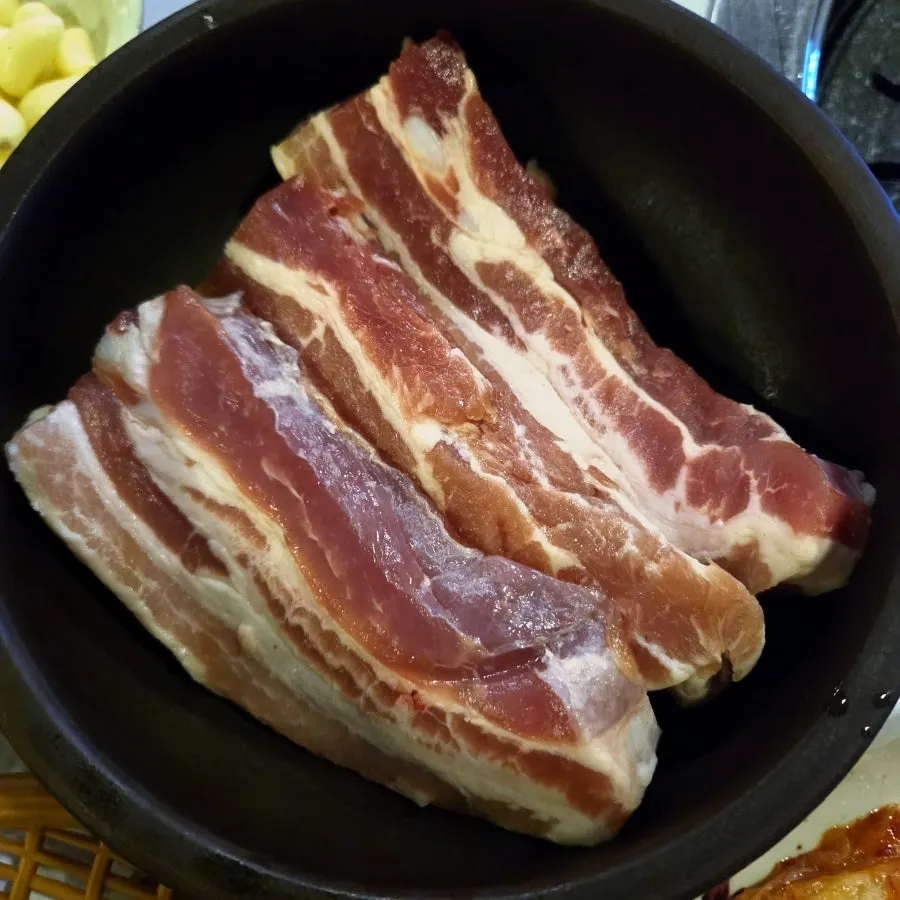 Staff grilling pork belly