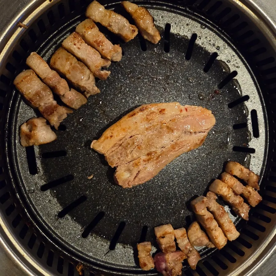 Pork belly and garlic on the grill