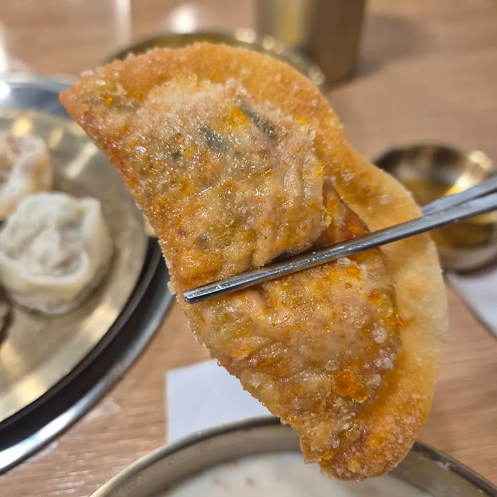 Crispy half-moon shaped fried mandu