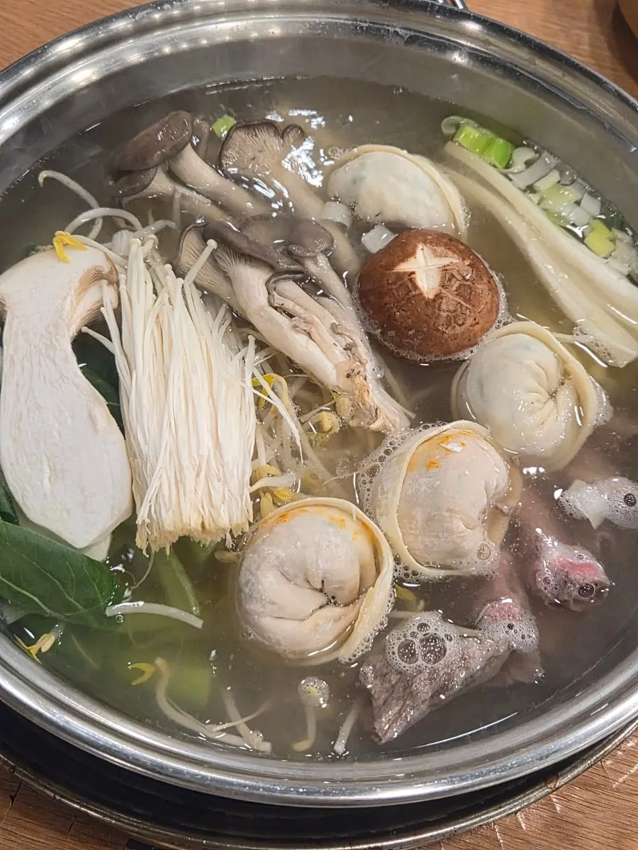 Mild mandu hot pot simmering on the burner