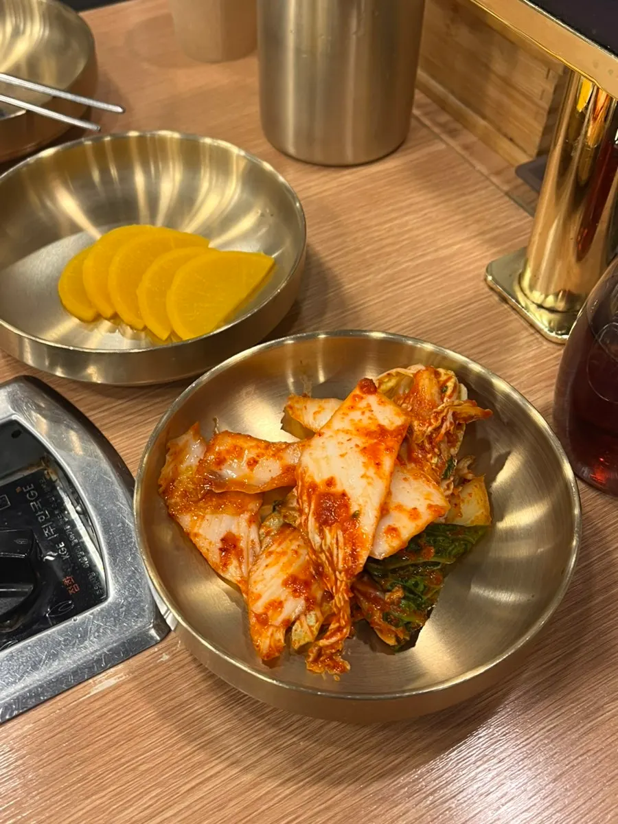 Self-service bar with side dishes and plates