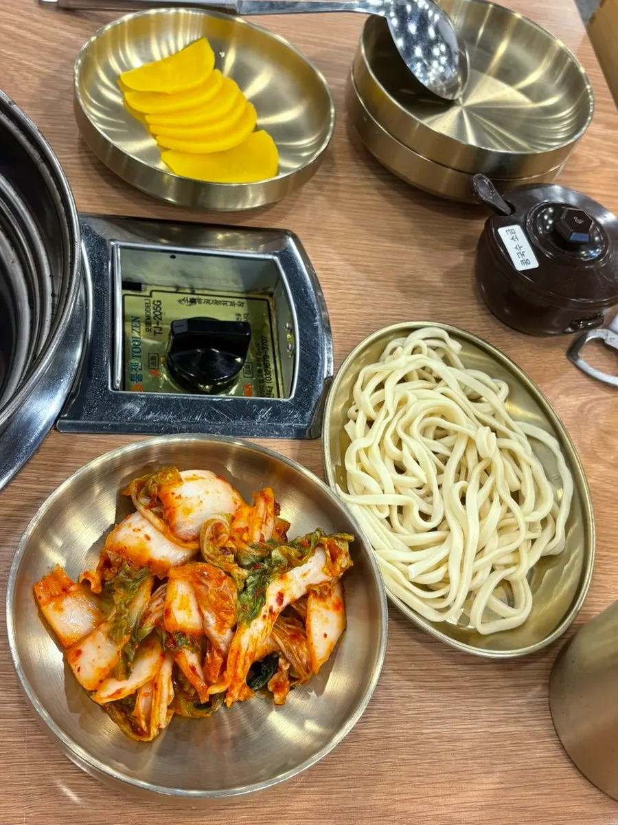Hot pot set with meat and kimchi dumplings