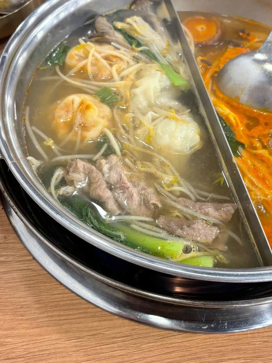 Kimchi dumpling and spicy broth