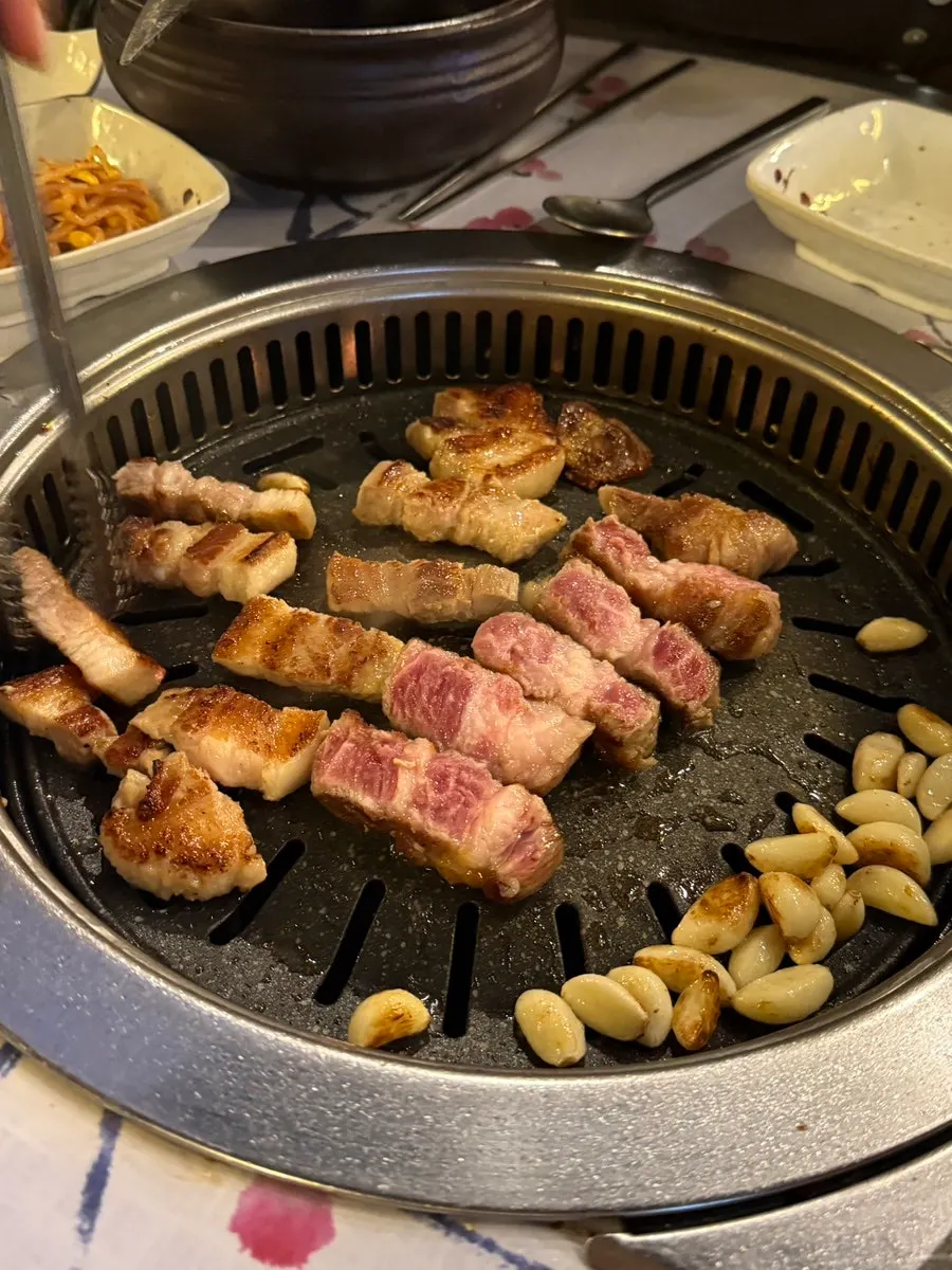 Pork belly and pork neck grilling on the tabletop grill