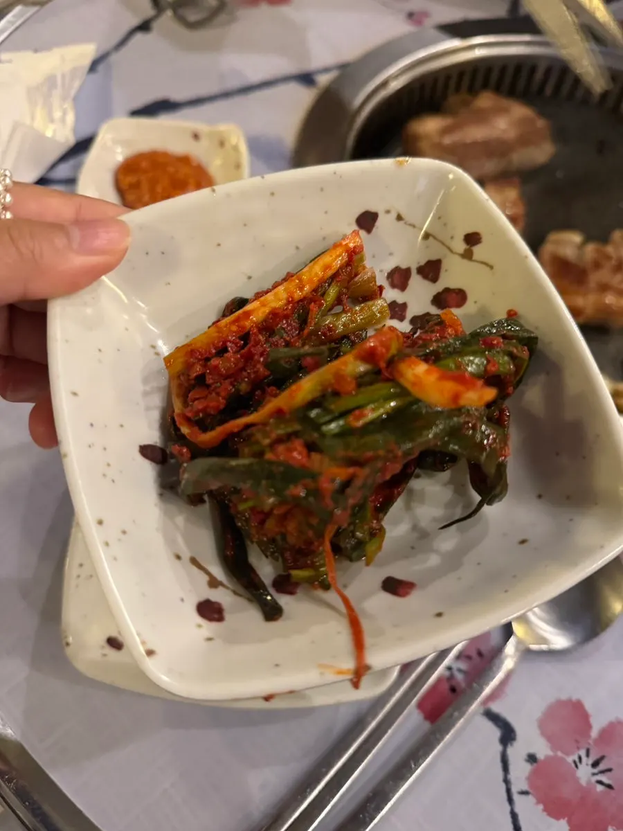 A plate of green onion kimchi from the self-serve bar