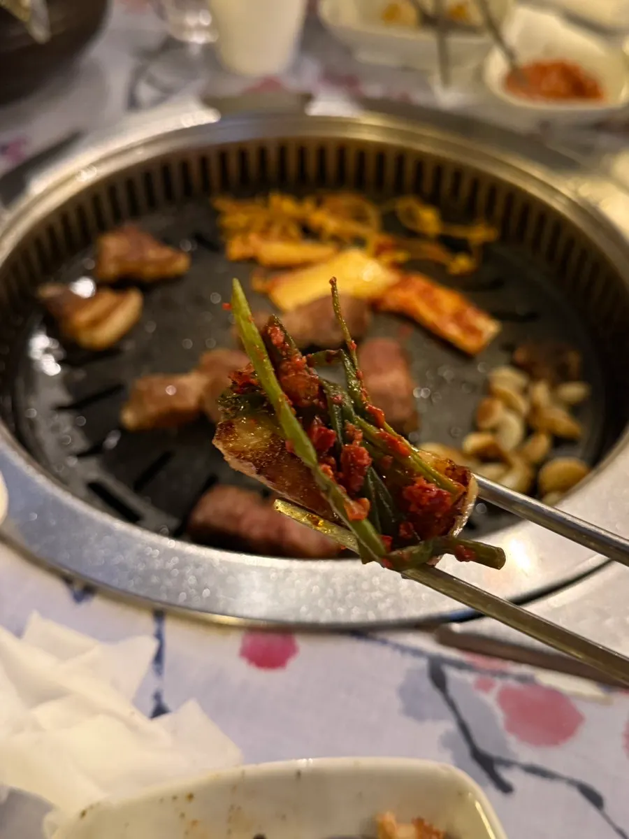 Meat topped with green onion kimchi