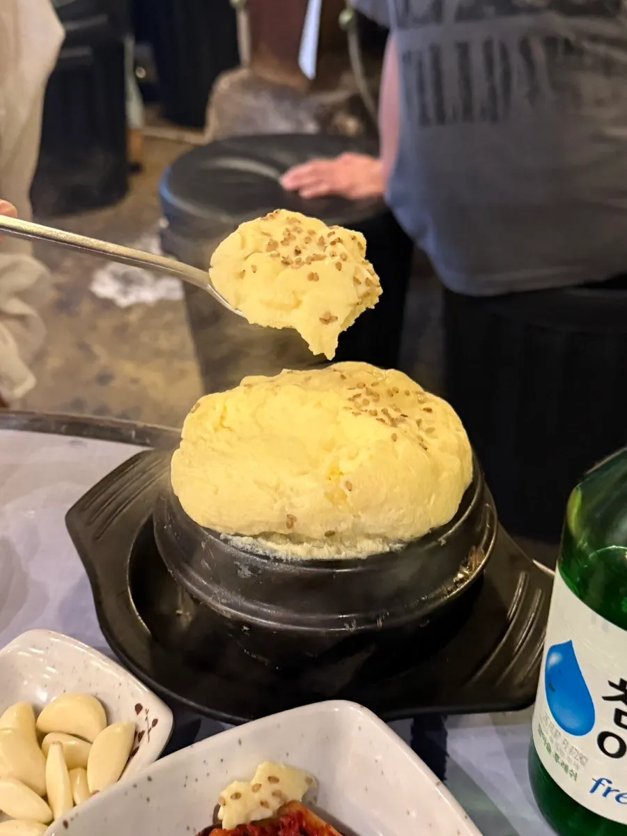 A scoop taken from the hot steamed egg