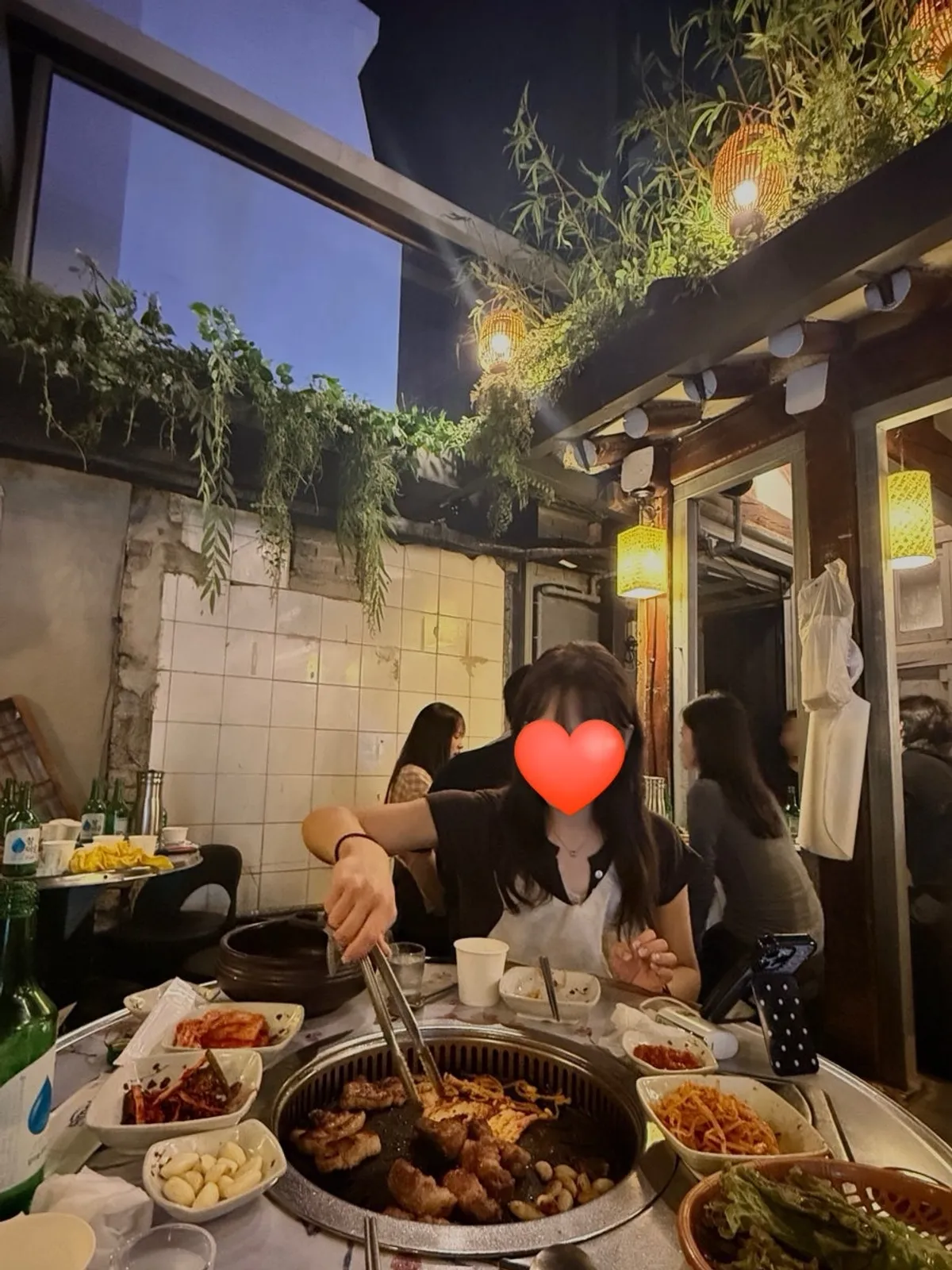 The lit-up patio atmosphere at Meongseokjip