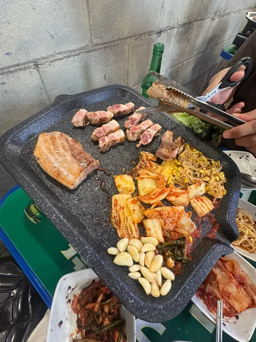 Pork belly and grilled kimchi wrapped in lettuce