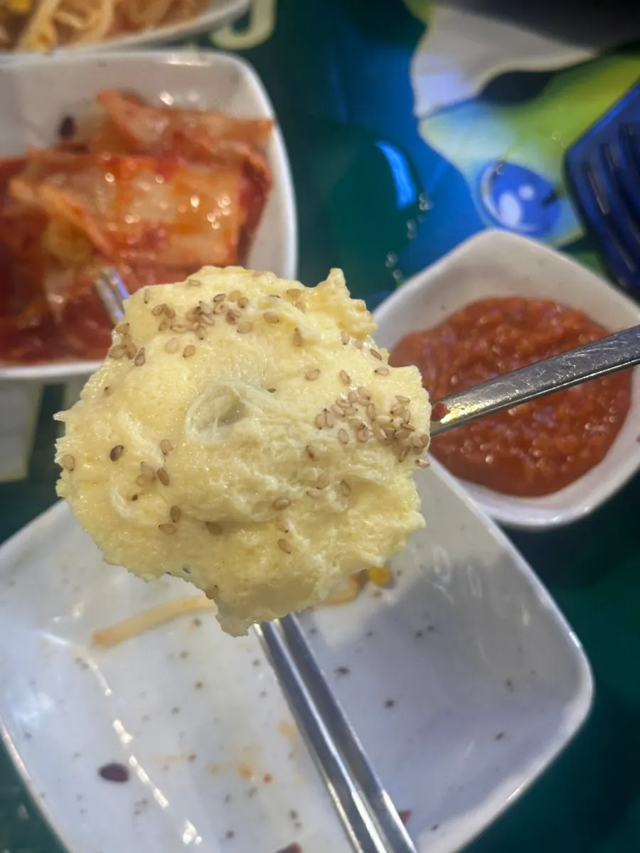 A spoonful of fluffy steamed egg