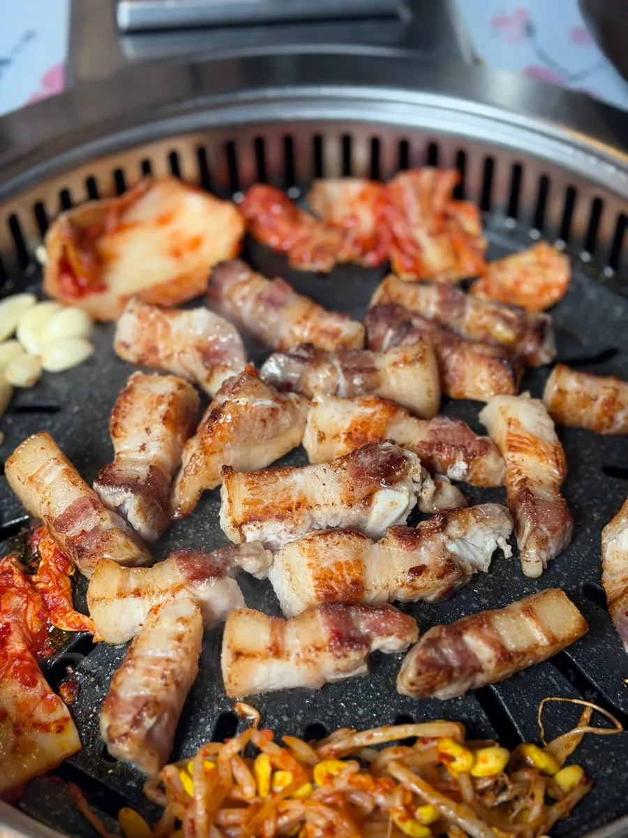 Pork belly grilling to a golden brown