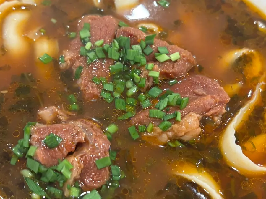 Beef dosakmyeon broth topped with beef