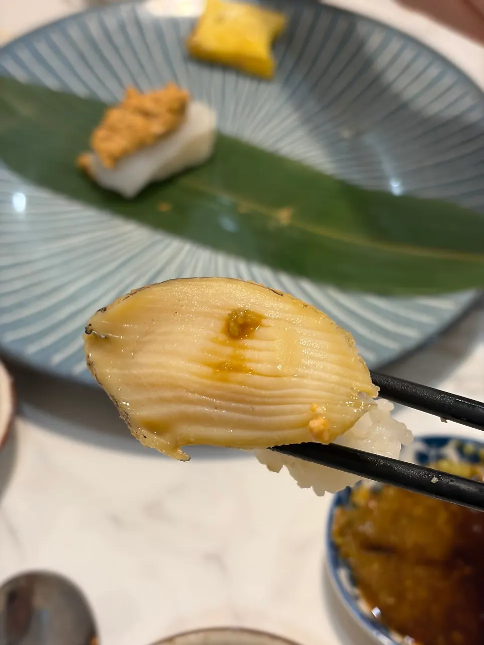 Sushi topped with red shrimp and sea urchin roe