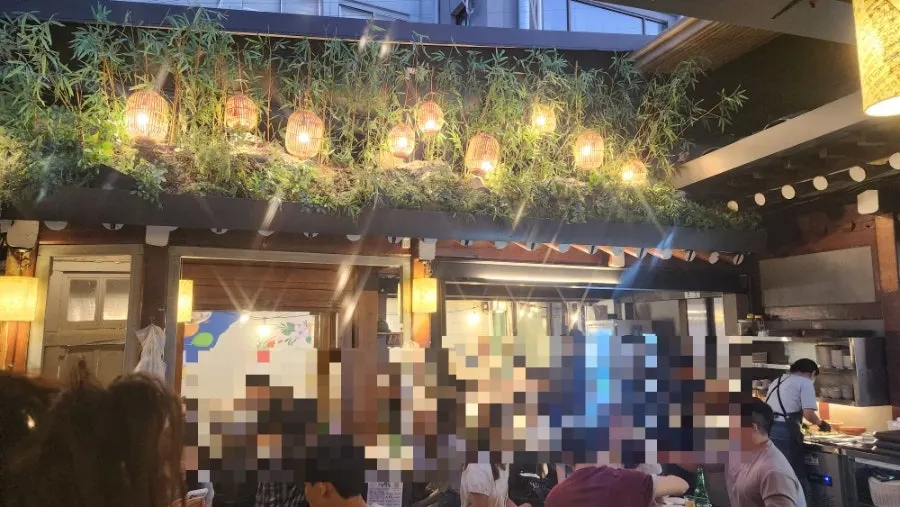 View of the outdoor street seating at Meongseokjip