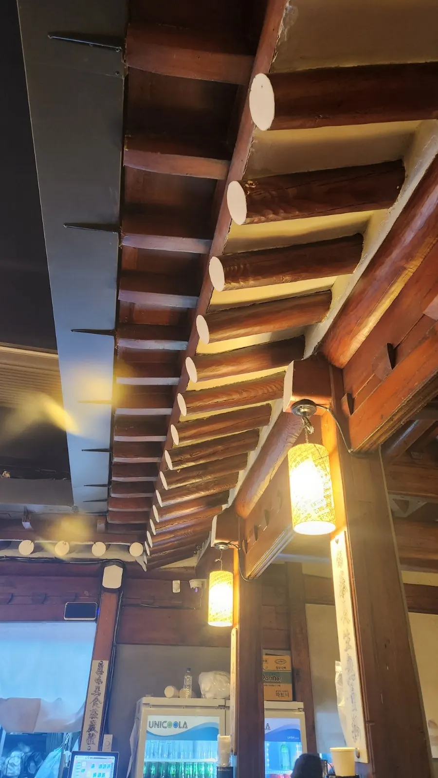 Evening view of Meongseokjip's old-town street BBQ setup