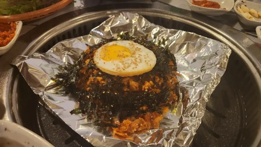 Kimchi fried rice topped with a soft fried egg
