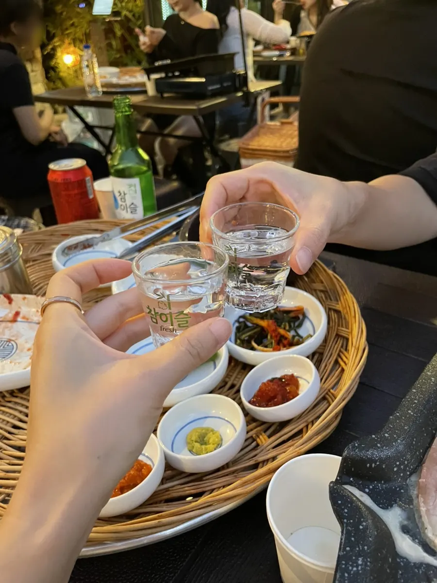 A soju glass and a piece of meat