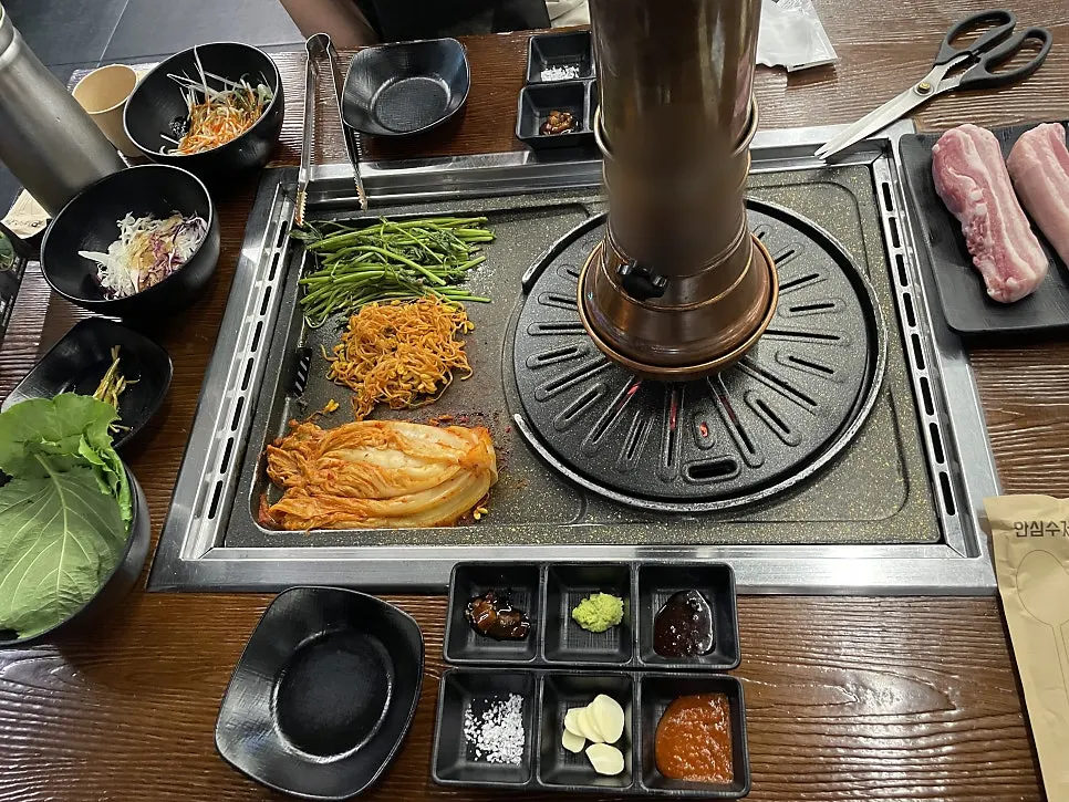 Table spread full of the grill plate and basic side dishes