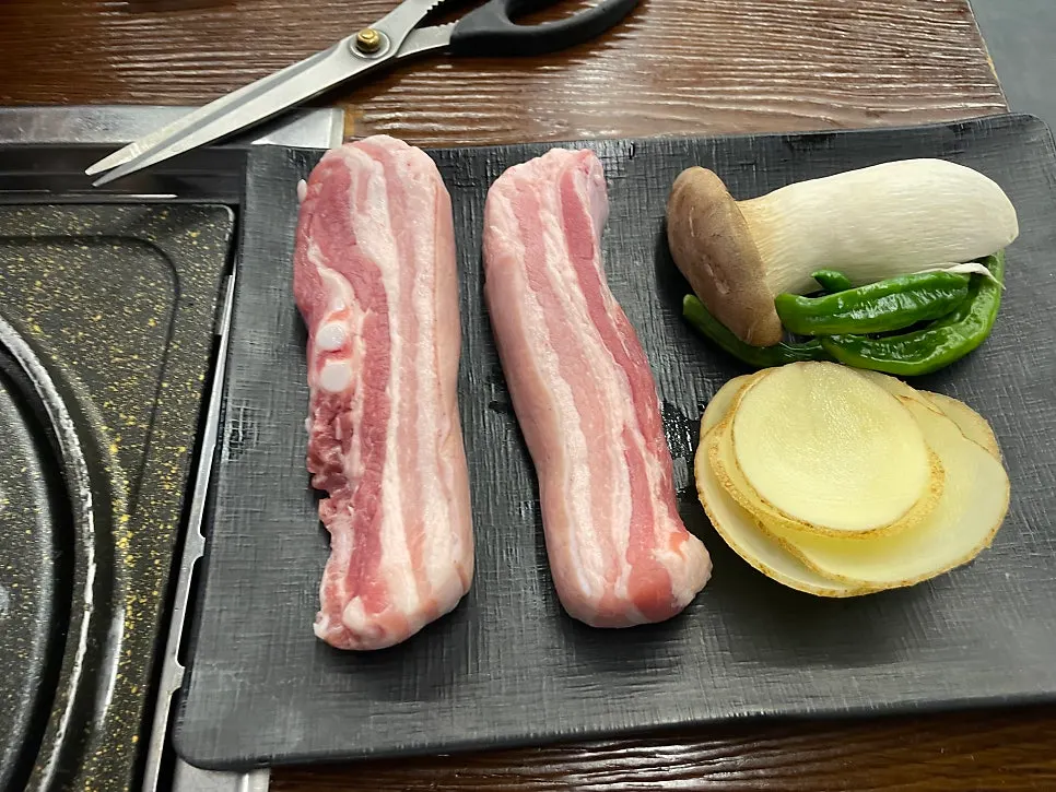 Accompanying side dishes and sauces including scallion salad and mushroom wasabi