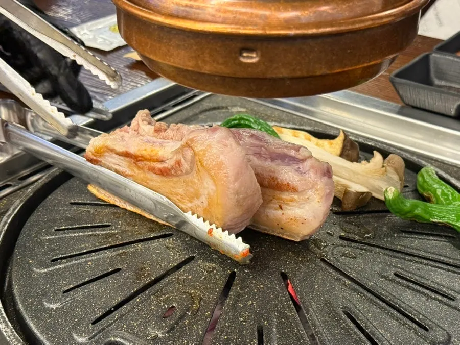 Pork belly cooking quickly over high heat