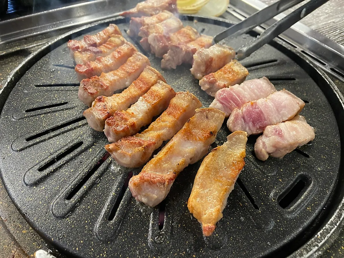 Golden-brown grilled black pork belly