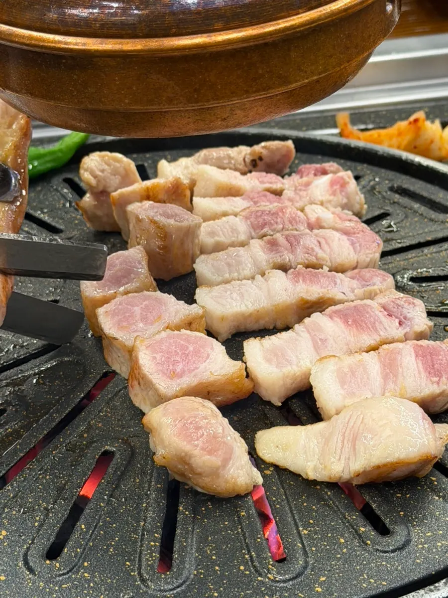 Samgyeopsal and hangjeongsal nearly fully cooked
