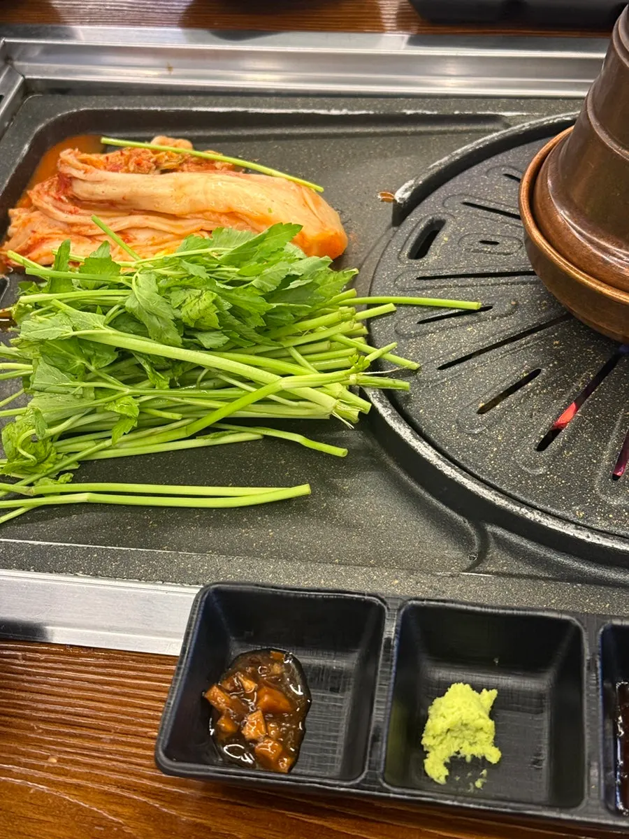 Cham Dwaejitgan pork belly on the grill