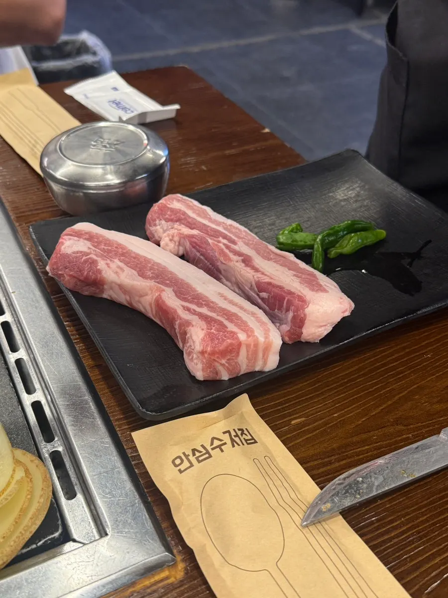 A piece of pork belly wrapped in potato slice