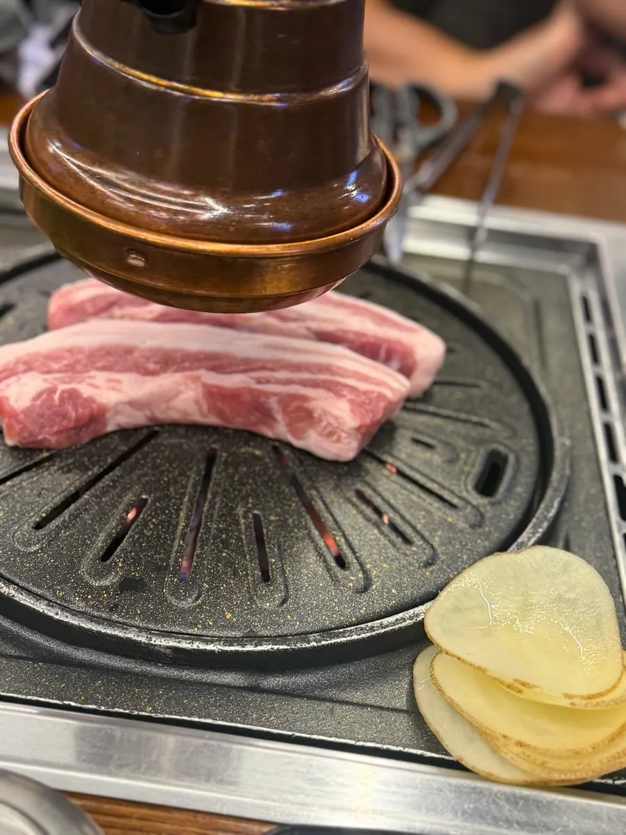 Side dishes served with pork belly at Cham Dwaejitgan Jongno Main Branch