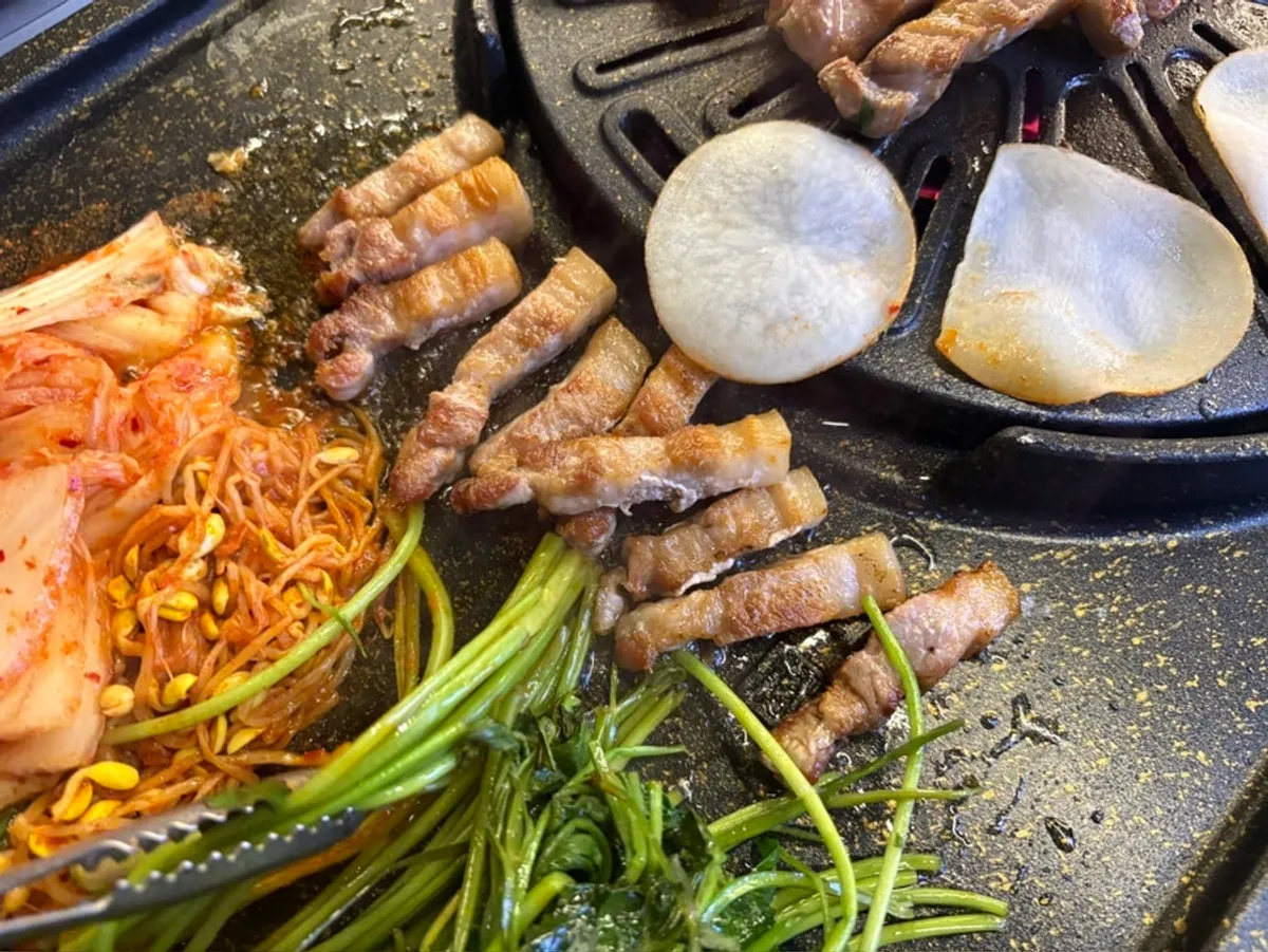 Pork belly table setting at Cham Dwaejitgan Jongno Main Branch