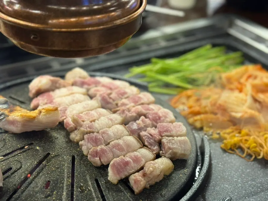 Close-up of ogyeopsal grilled by staff