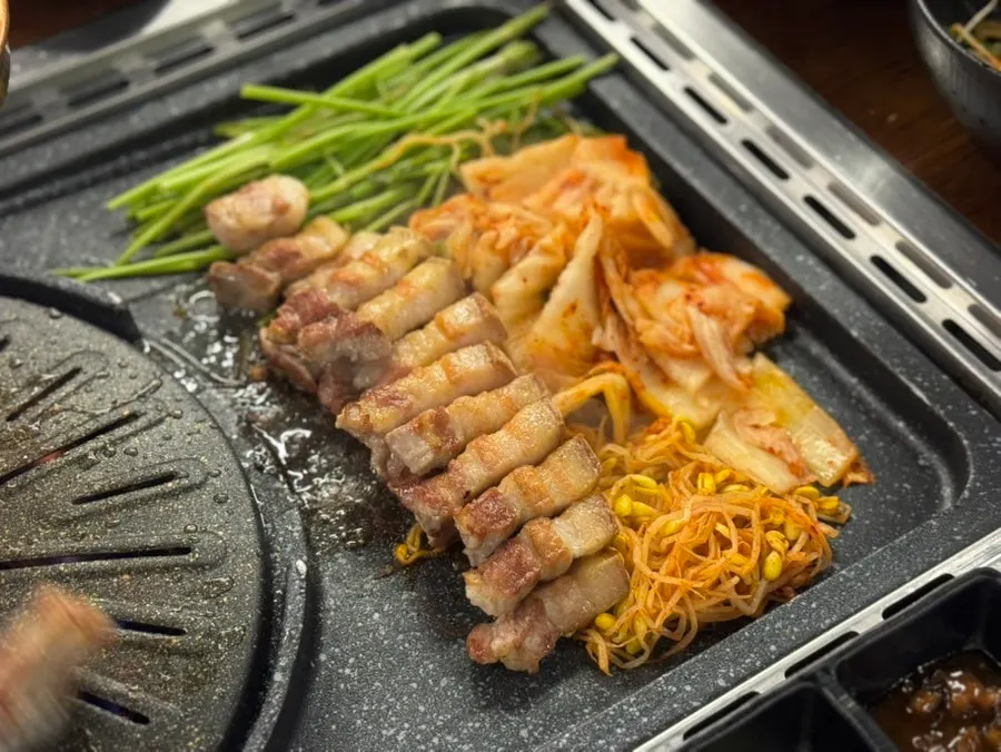 Fully cooked meat set aside on the grill