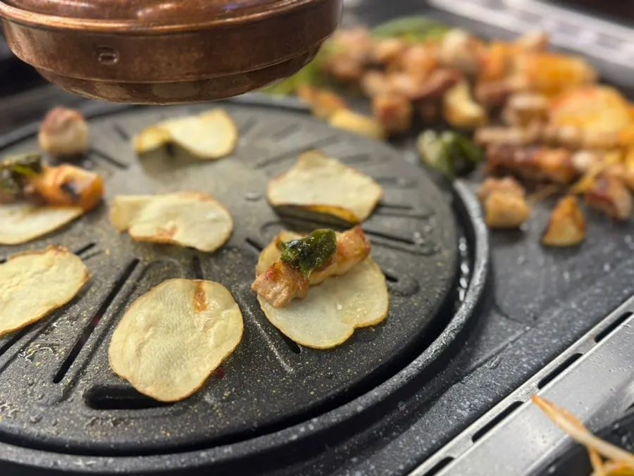 A bite with wrap vegetables and shiitake wasabi sauce