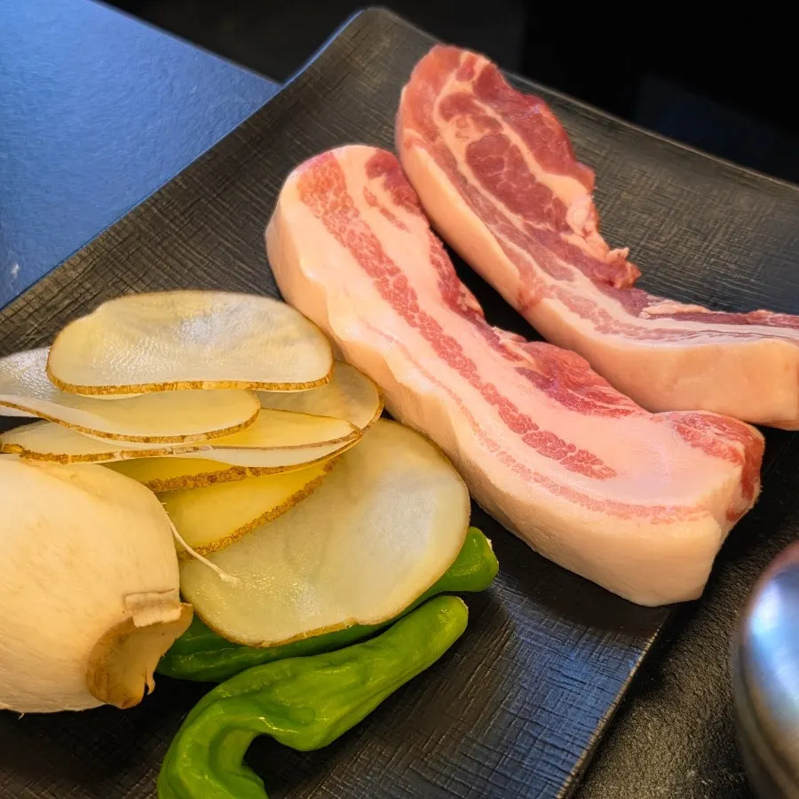 Pork belly table setting at Cham Dwaejitgan Jongno Main Branch near Jongno3-ga Station