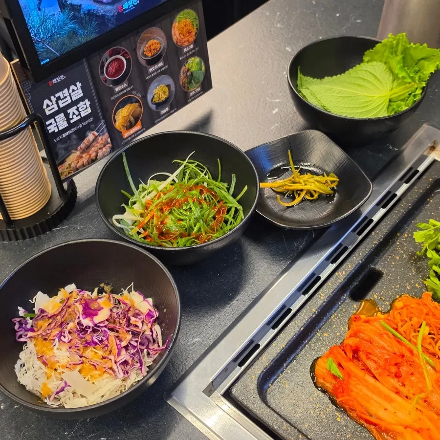 Full spread of basic side dishes at Cham Dwaejitgan Jongno Main Branch