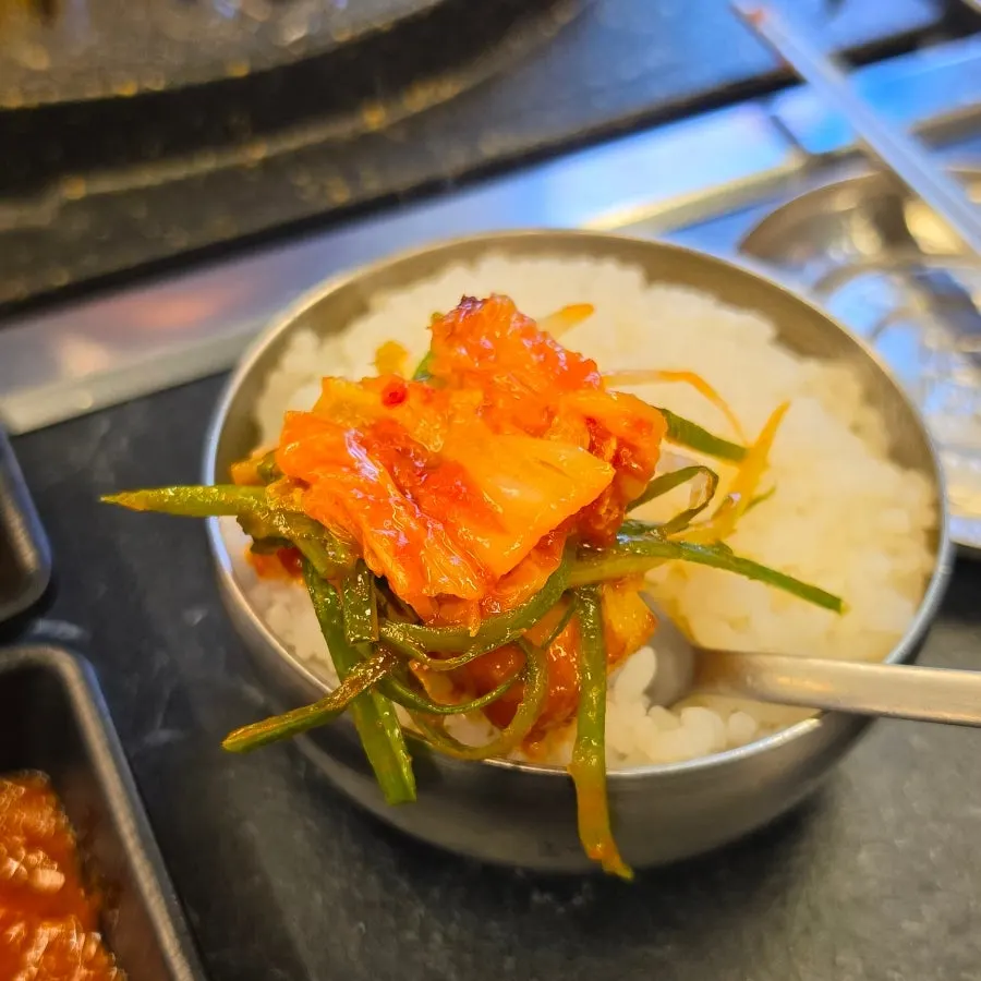 Pork belly wrapped with minari and scallion shreds