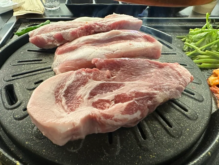 Pork belly with visible layers of fat and lean meat