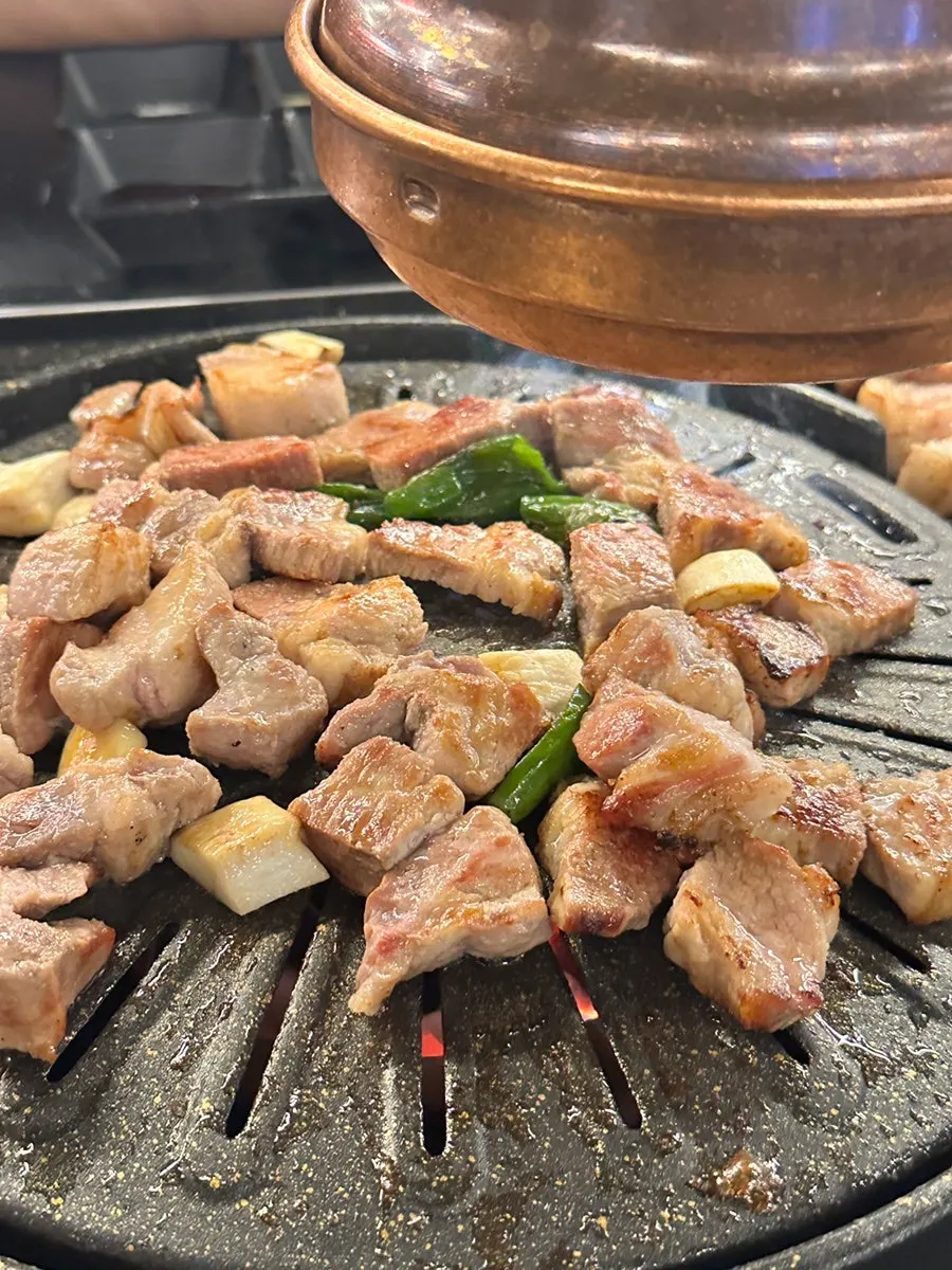 Grilled pork belly cut into bite-sized pieces