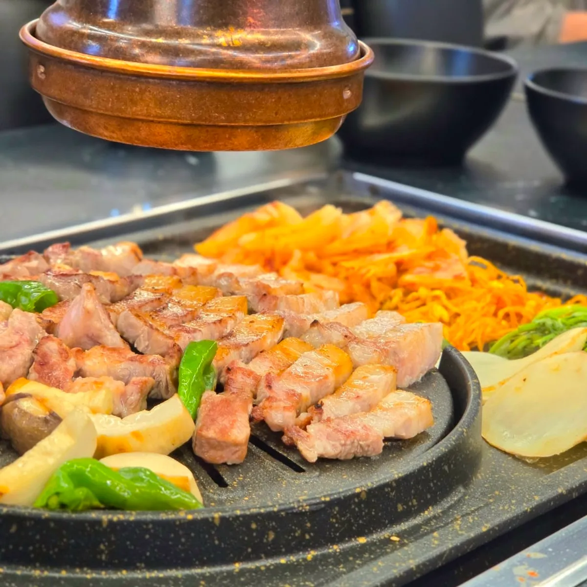Signature photo of grilled pork belly at Cham Dwaejitgan Jongno Main Branch