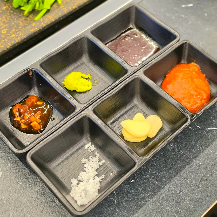 Dipping sauces including salt, wasabi, and buldak sauce