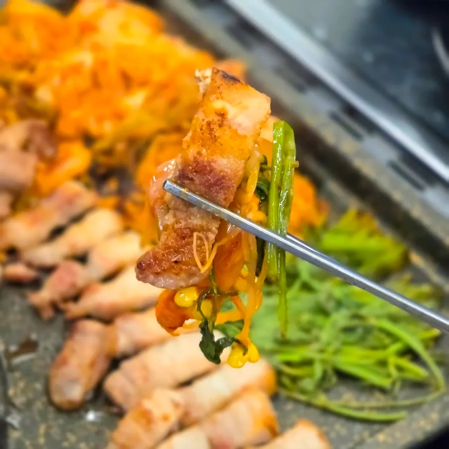 Grilled kimchi and bean sprouts wrapped in minari