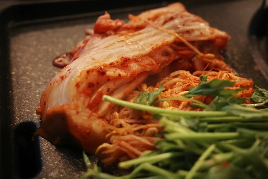 Thick cham samgyeopsal grilling on the pan