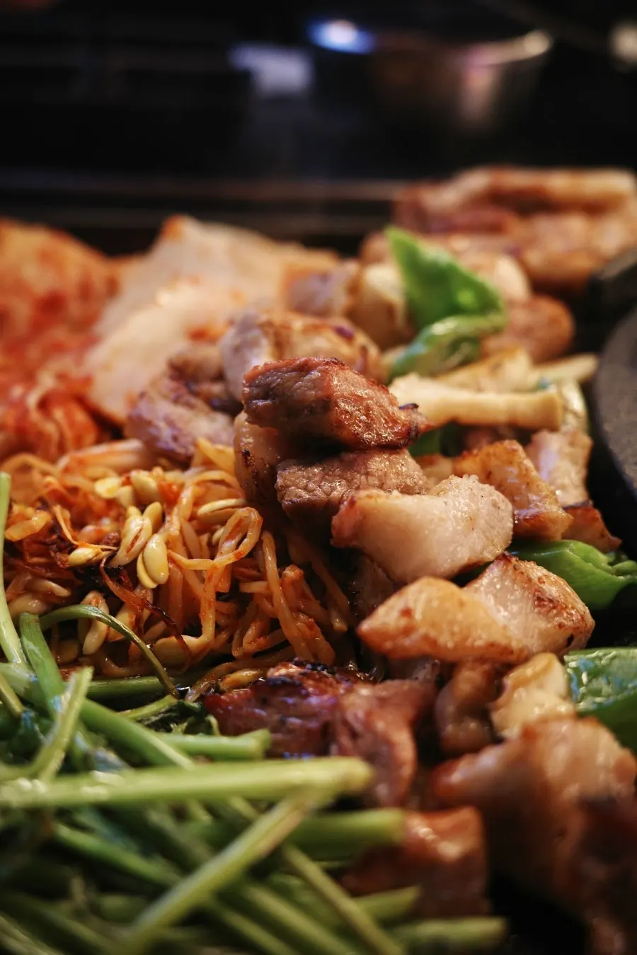 Close-up of thick pork chunks in the kimchi stew