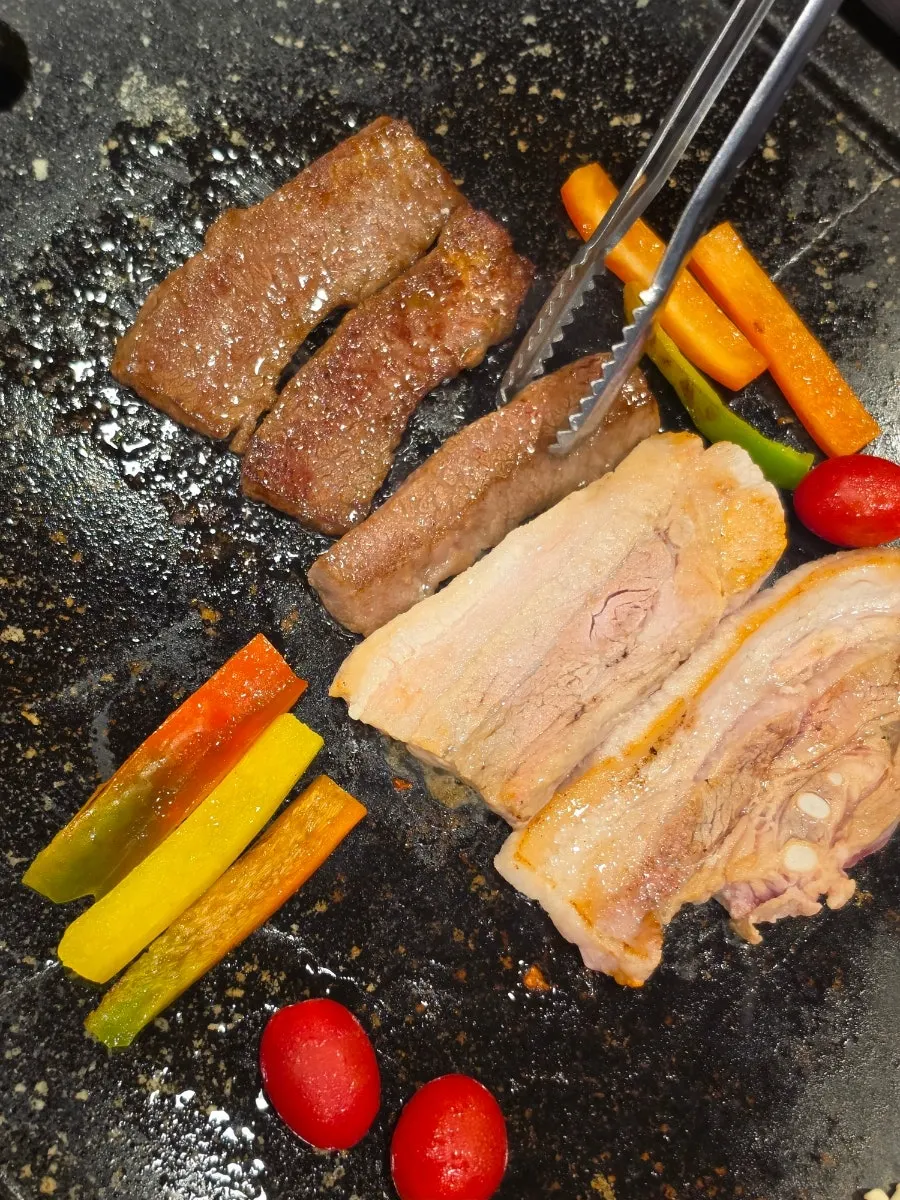 Staff grilling the meat