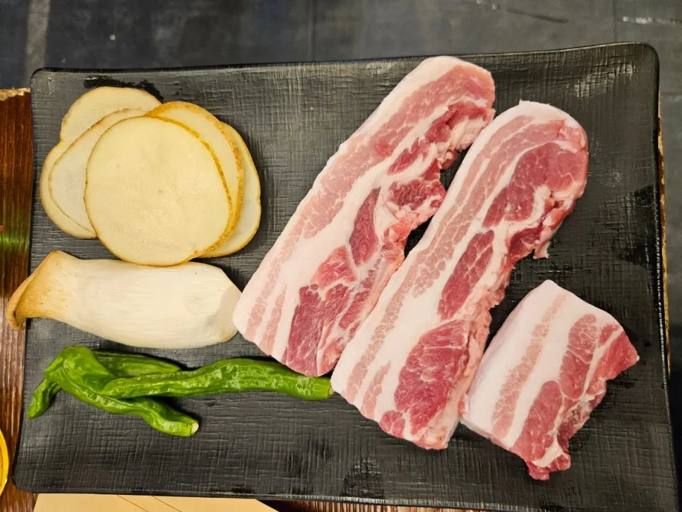 Minari and kimchi grilling on the pan