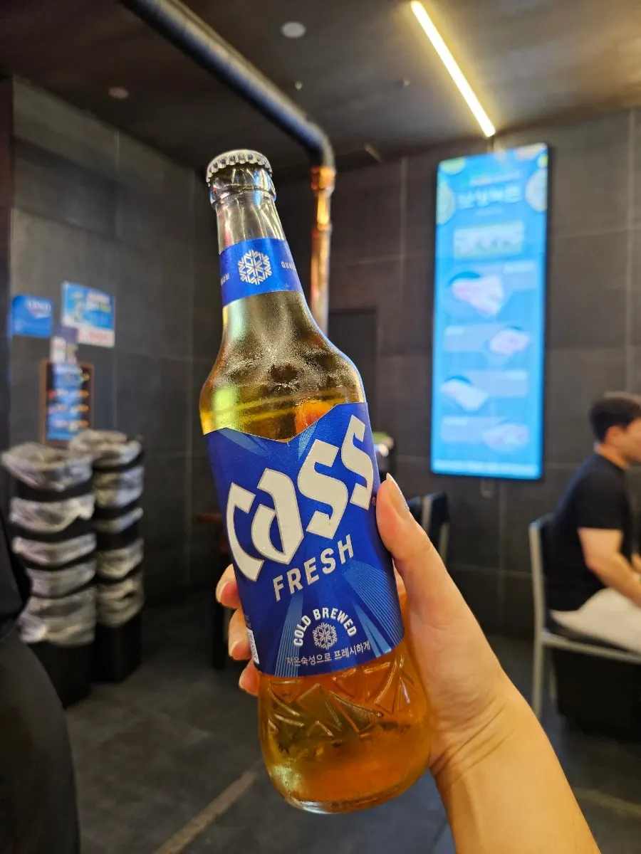 Soju and beer with a milk thistle necklace on the bottle