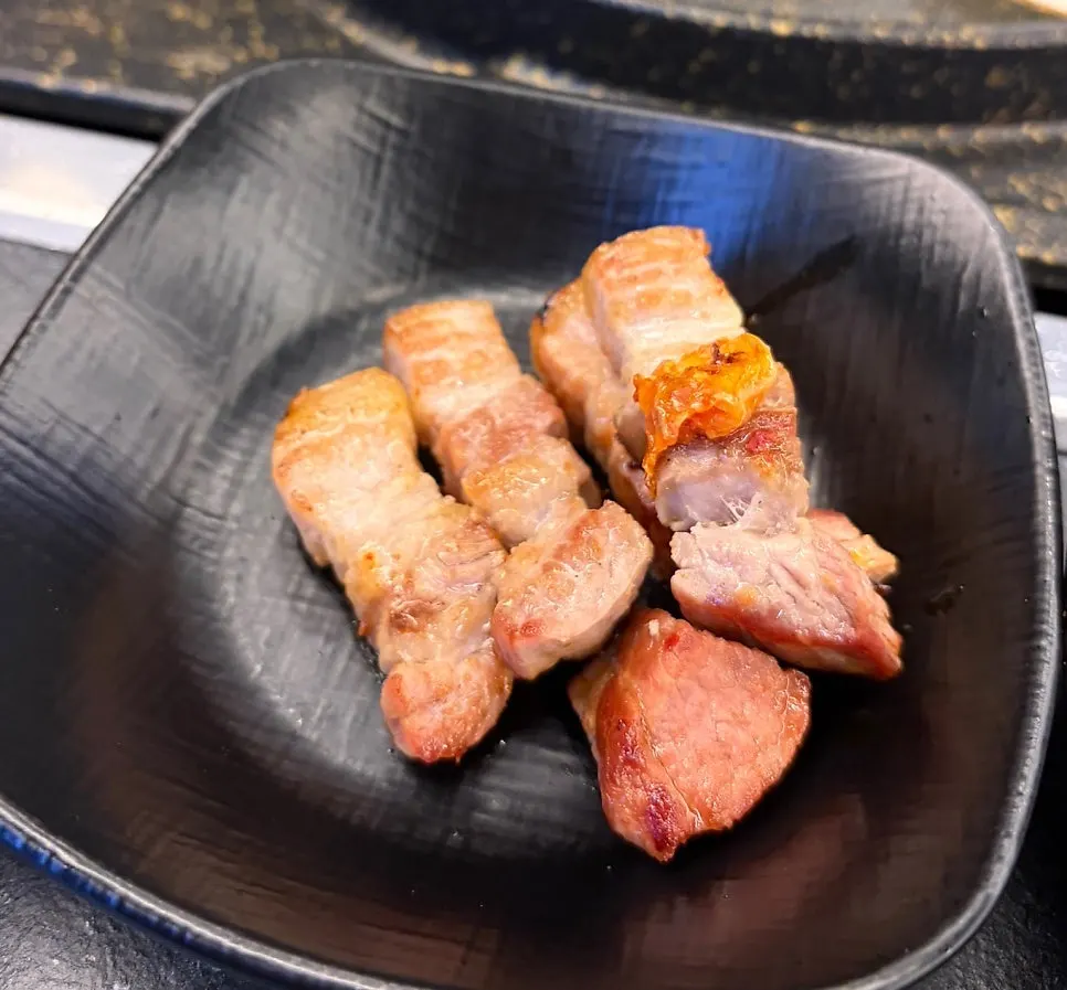 A piece of meat with mushroom wasabi on the side