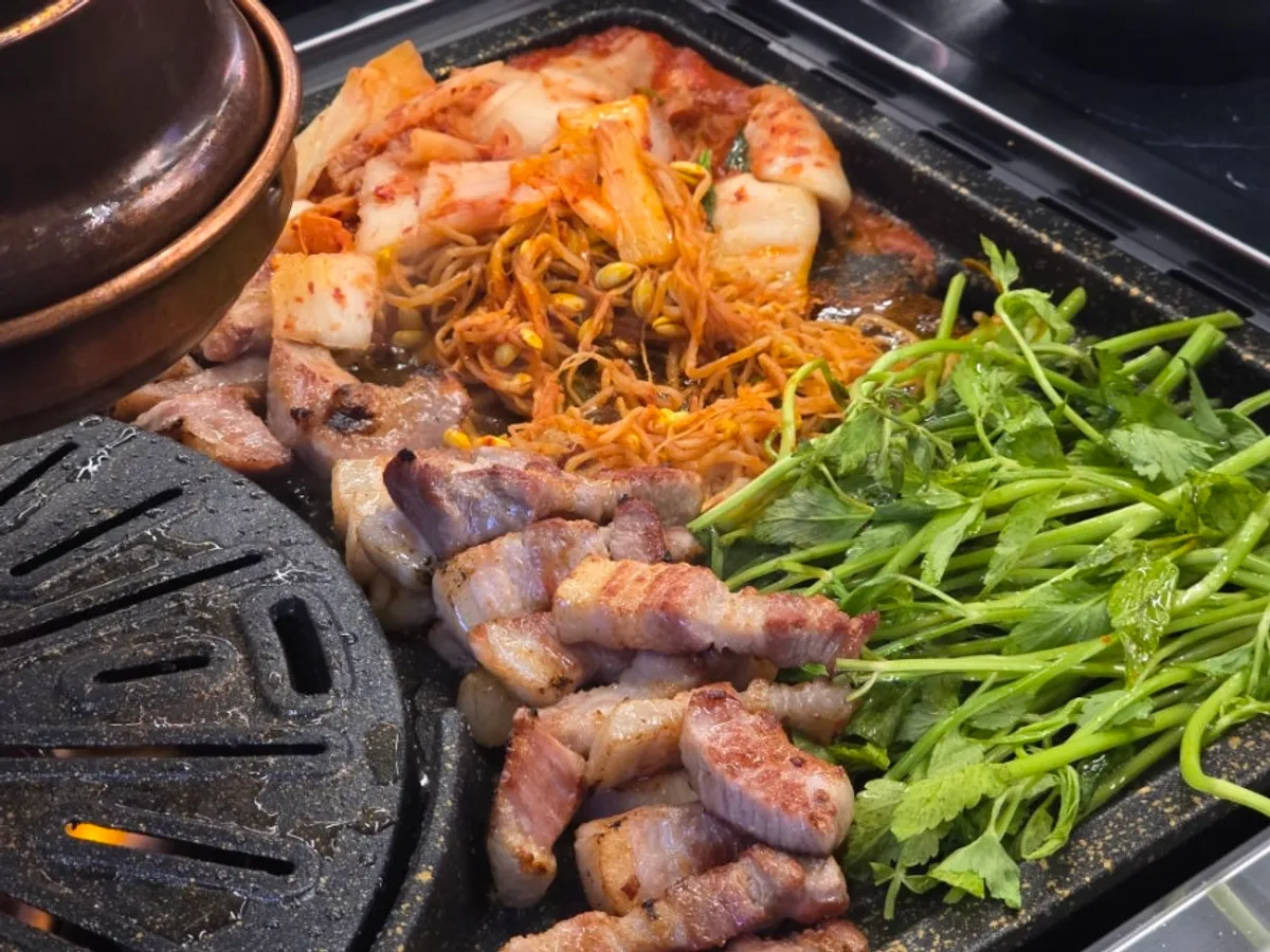 Pork belly grilling on the pan