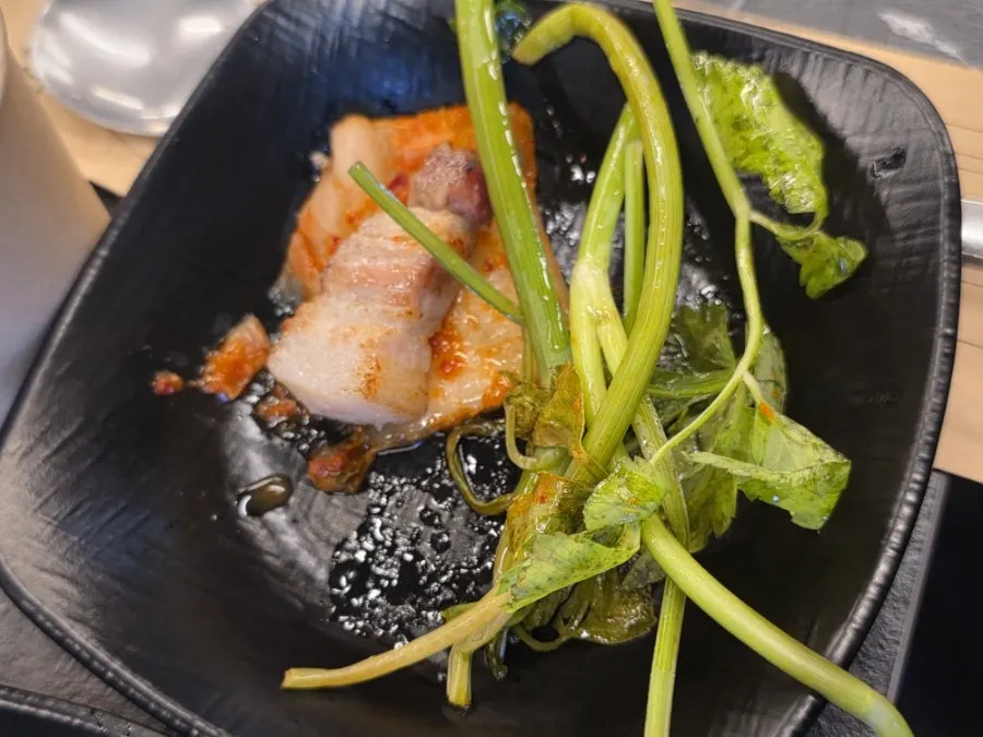 Pork belly and kimchi cut up by staff